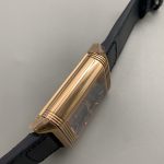 Macro of the thin gold perimeter track and applied gold batons on the blue Reverso dial