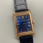 Reverso Tribute Duoface replica worn on the wrist, rectangular rose gold case lying flat