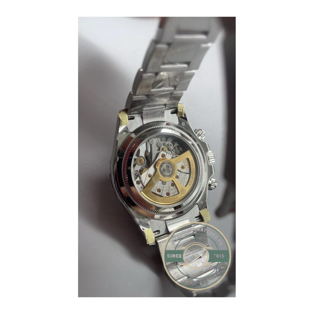 Rolex super clone open caseback showing the clone chronograph movement with gold rotor and decorated bridges